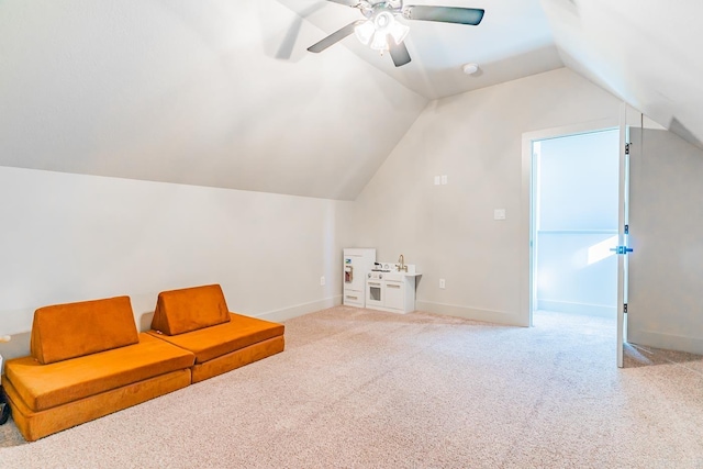 additional living space with carpet floors, ceiling fan, and lofted ceiling