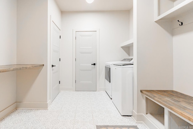 laundry room with washing machine and clothes dryer