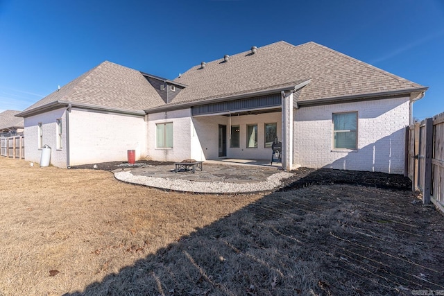 rear view of house featuring a fire pit, ceiling fan, and a patio