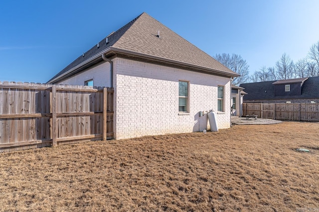 view of home's exterior featuring a patio area and a yard