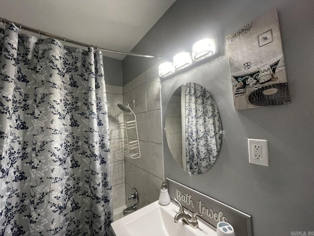 bathroom with shower / bath combo with shower curtain