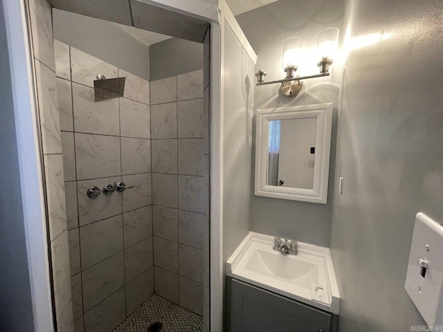 bathroom featuring vanity and a tile shower