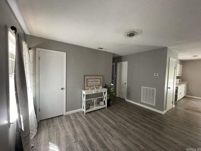 empty room featuring dark wood-type flooring