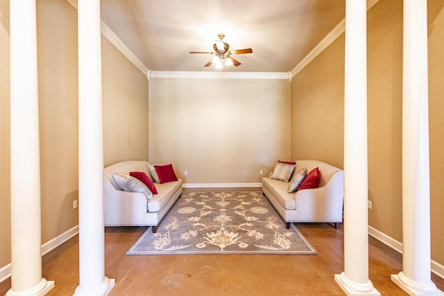 sitting room with ceiling fan, ornamental molding, and decorative columns