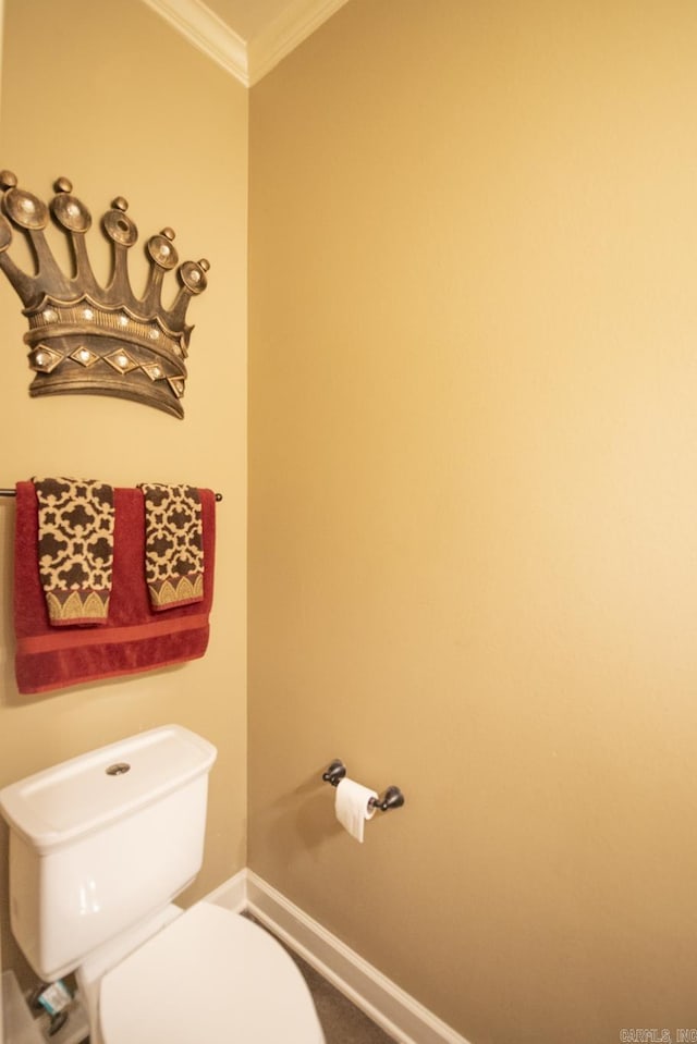 bathroom with toilet and ornamental molding