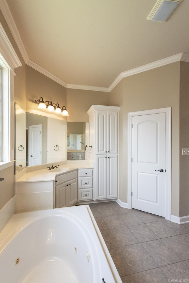 bathroom featuring tile patterned flooring, vanity, a tub to relax in, and crown molding