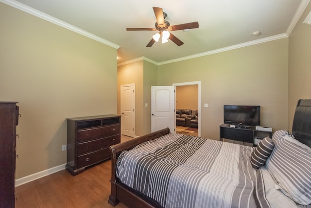 bedroom with hardwood / wood-style flooring, ceiling fan, and ornamental molding