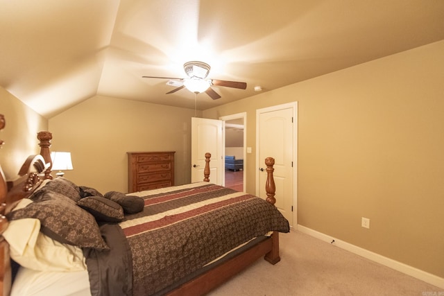 carpeted bedroom featuring ceiling fan and lofted ceiling