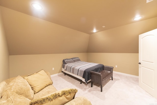 bedroom featuring carpet and vaulted ceiling