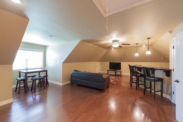 additional living space with ceiling fan, dark hardwood / wood-style flooring, and vaulted ceiling