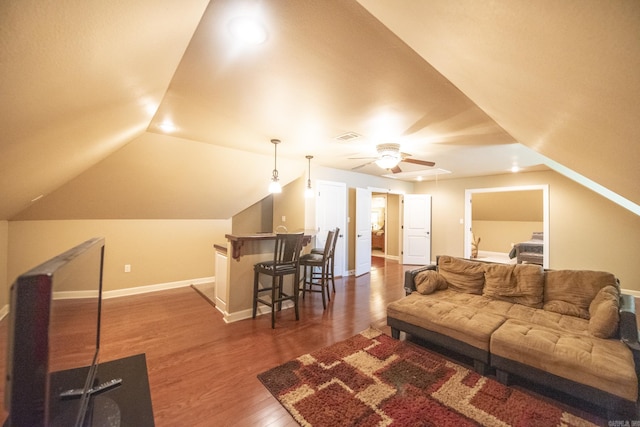 living room with ceiling fan, dark hardwood / wood-style flooring, and lofted ceiling