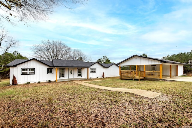 rear view of property featuring a lawn