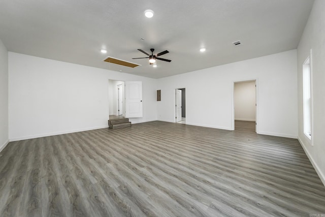 unfurnished living room with ceiling fan and wood-type flooring