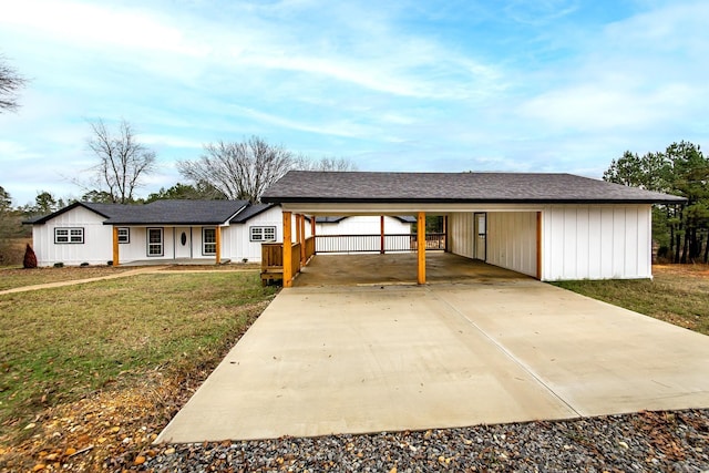 single story home with a carport and a front lawn