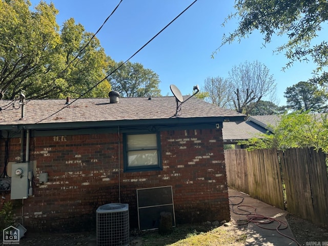 view of home's exterior with central AC unit