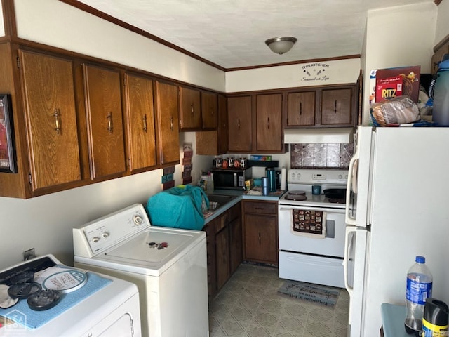 kitchen with white appliances and independent washer and dryer