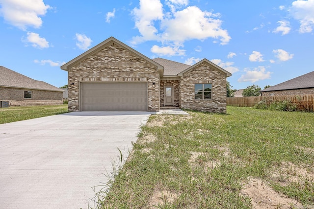 view of front facade featuring a garage and a front lawn