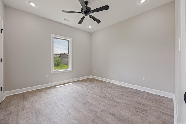 spare room with ceiling fan and light hardwood / wood-style floors