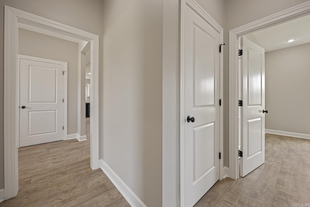 hallway with light wood-type flooring