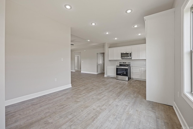 unfurnished living room featuring light hardwood / wood-style flooring