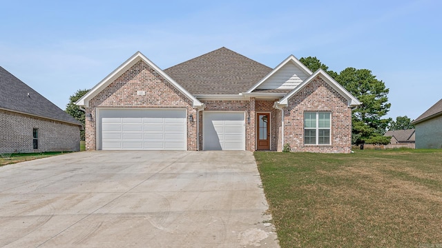 view of front facade featuring a garage and a front lawn