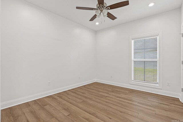 spare room featuring ceiling fan and light wood-type flooring