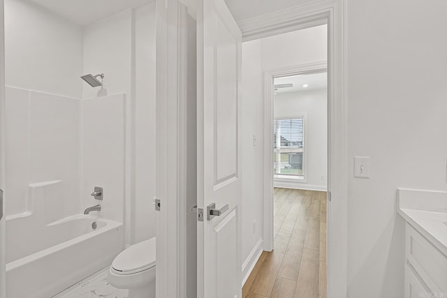 full bathroom featuring shower / bathing tub combination, vanity, toilet, and wood-type flooring