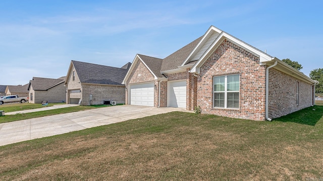 view of front of house featuring a garage and a front lawn