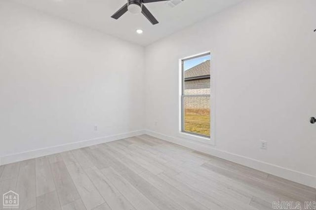 unfurnished room featuring ceiling fan and light wood-type flooring