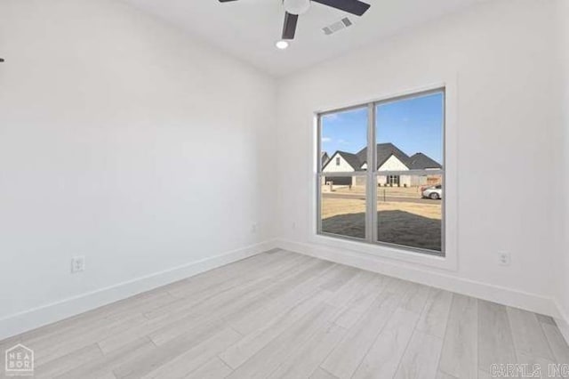 spare room with ceiling fan and light hardwood / wood-style floors