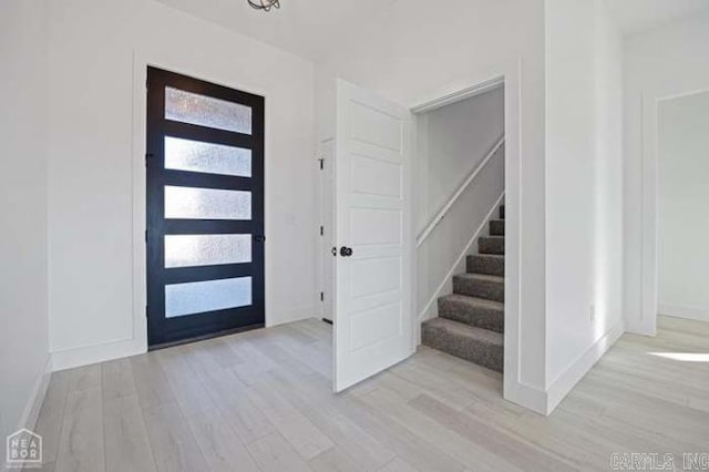 entrance foyer with light wood-type flooring