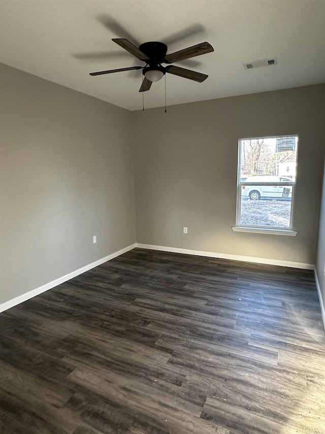 unfurnished room featuring dark hardwood / wood-style floors and ceiling fan