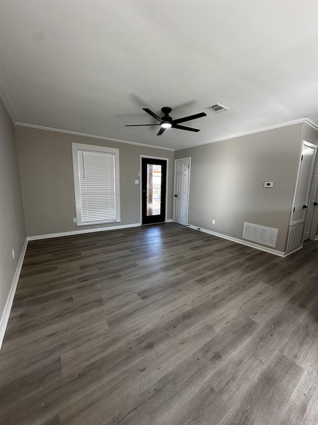 interior space with dark hardwood / wood-style floors, ceiling fan, and crown molding