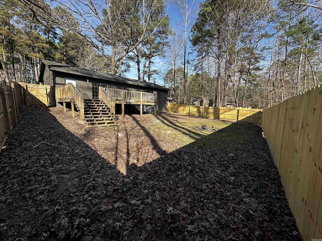 view of yard featuring a wooden deck