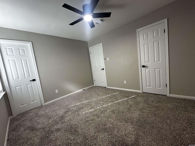 unfurnished bedroom featuring carpet flooring and ceiling fan