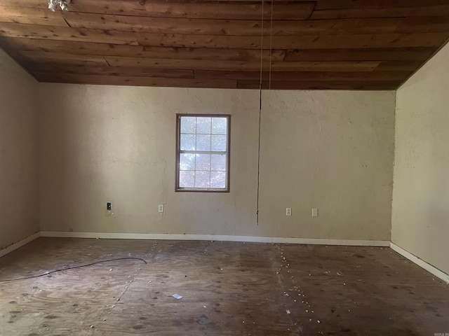 spare room featuring lofted ceiling and wooden ceiling