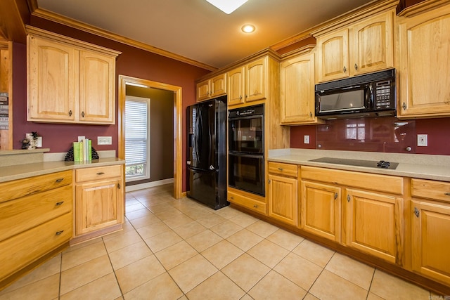 kitchen featuring light tile patterned flooring, crown molding, and black appliances