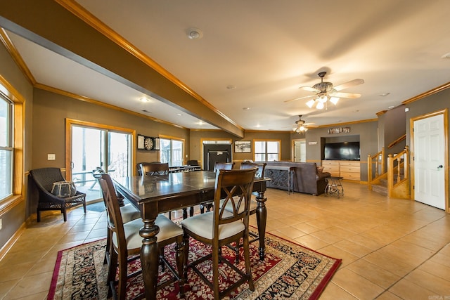 dining area with ceiling fan, light tile patterned floors, and ornamental molding