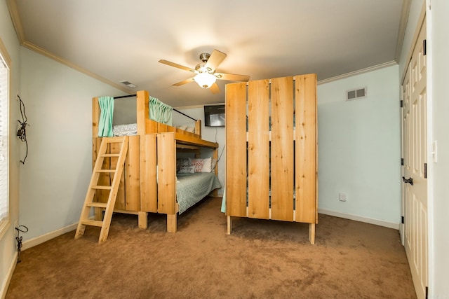 unfurnished bedroom with carpet flooring, ceiling fan, and crown molding