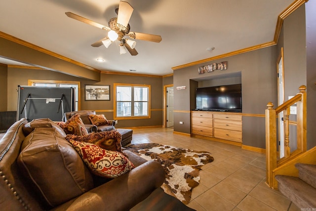 living room with ceiling fan, ornamental molding, and light tile patterned floors