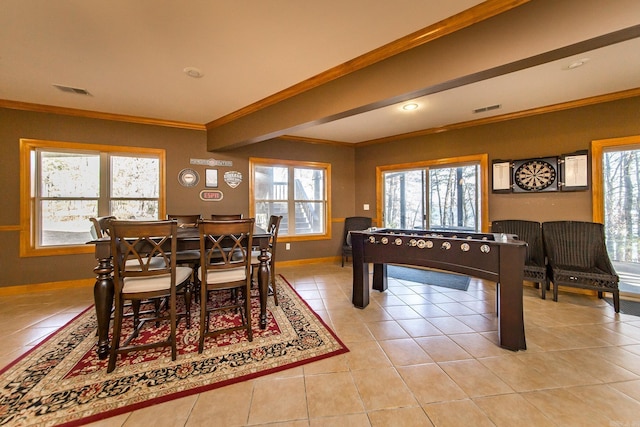 game room featuring plenty of natural light, light tile patterned flooring, and crown molding