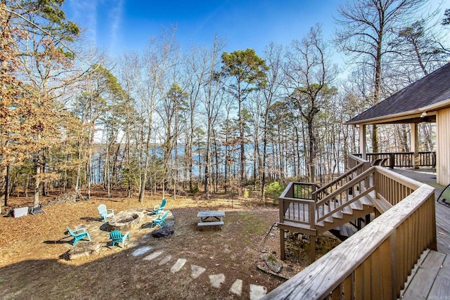 view of yard with a fire pit and a deck