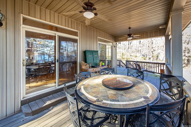 wooden terrace featuring ceiling fan