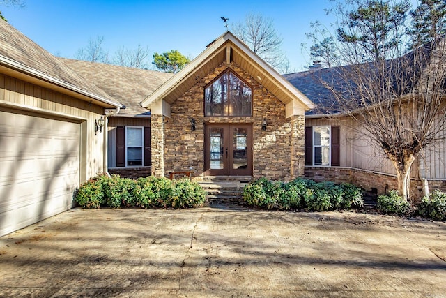 entrance to property with french doors and a garage