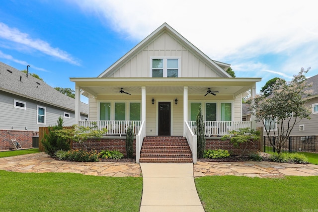 view of front of property with a porch, a front lawn, and ceiling fan