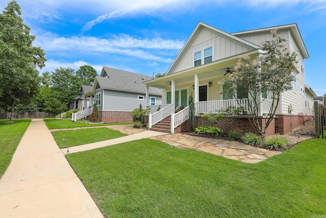 view of front facade with a porch and a front lawn