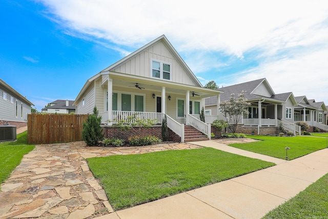 view of front facade with covered porch, central AC, and a front lawn