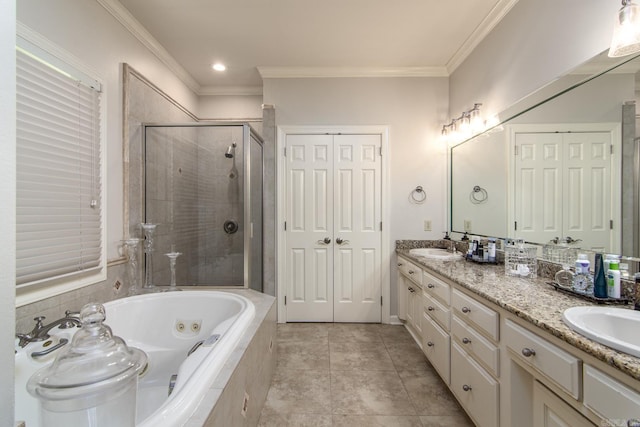 bathroom featuring plus walk in shower, vanity, tile patterned floors, and crown molding