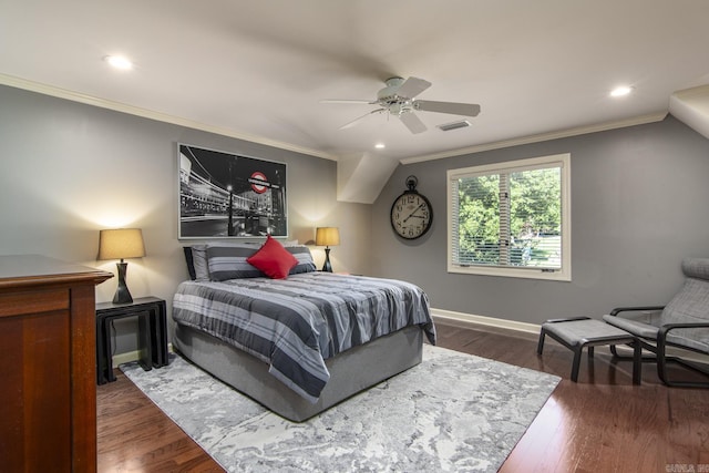 bedroom with ceiling fan, dark hardwood / wood-style floors, and ornamental molding