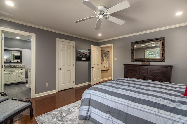 bedroom featuring ensuite bathroom, sink, ceiling fan, ornamental molding, and dark hardwood / wood-style flooring